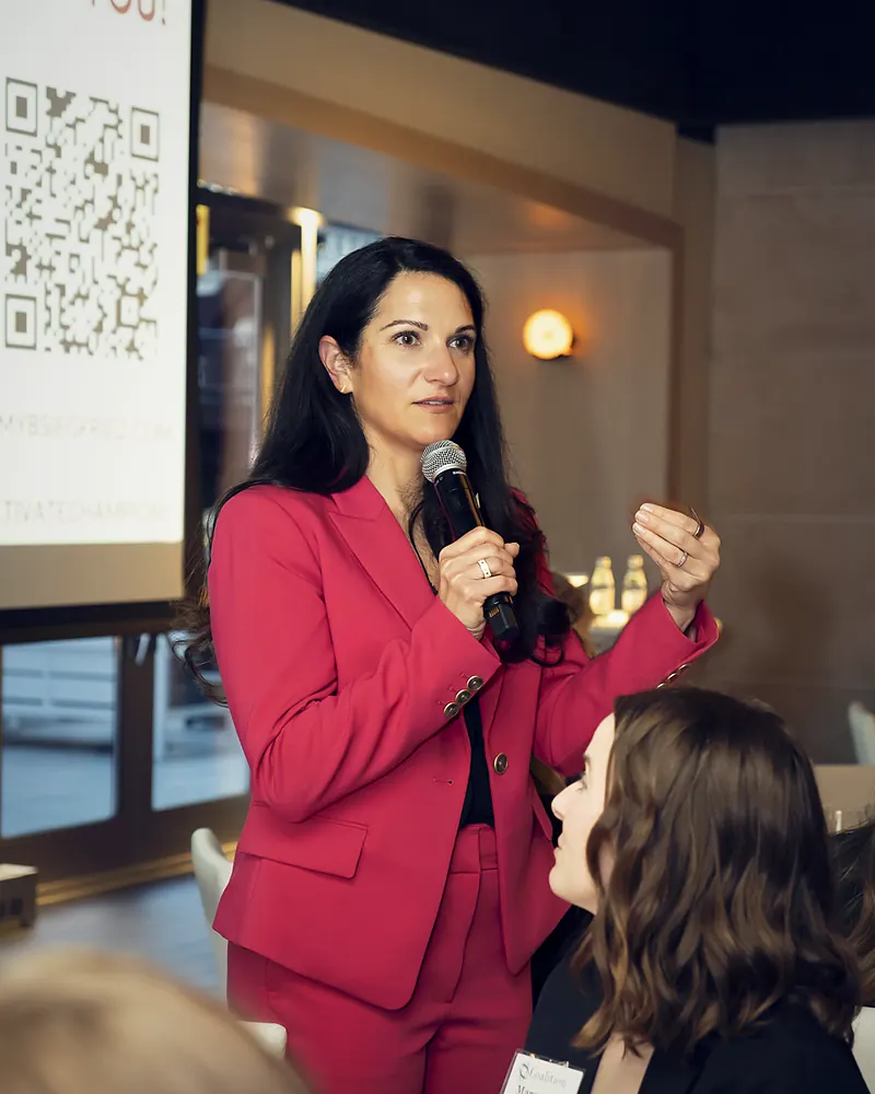 Me with a microphone, answering one woman in the audience directly